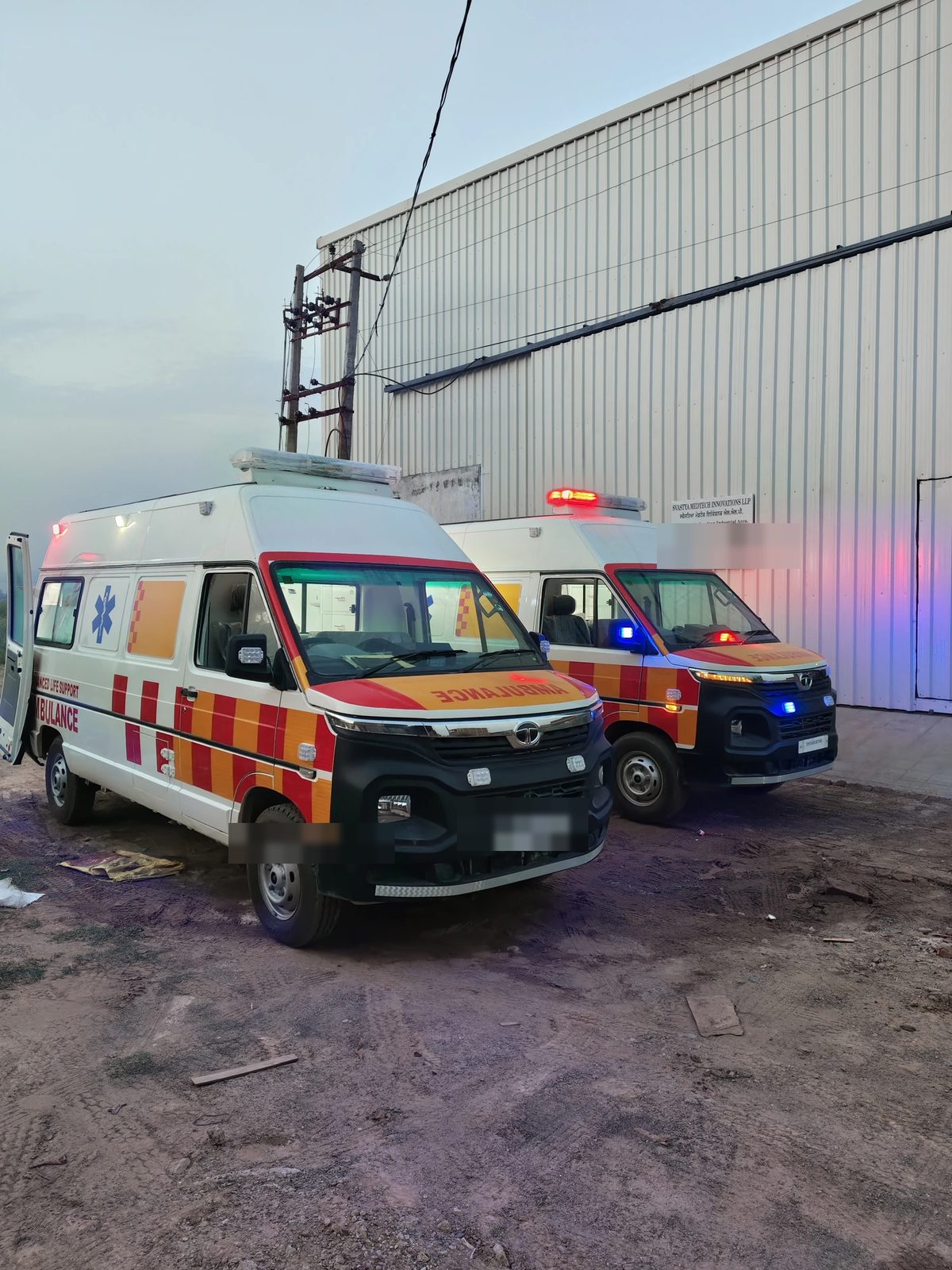 Two completed advanced life support ambulances outside the Svastya plant