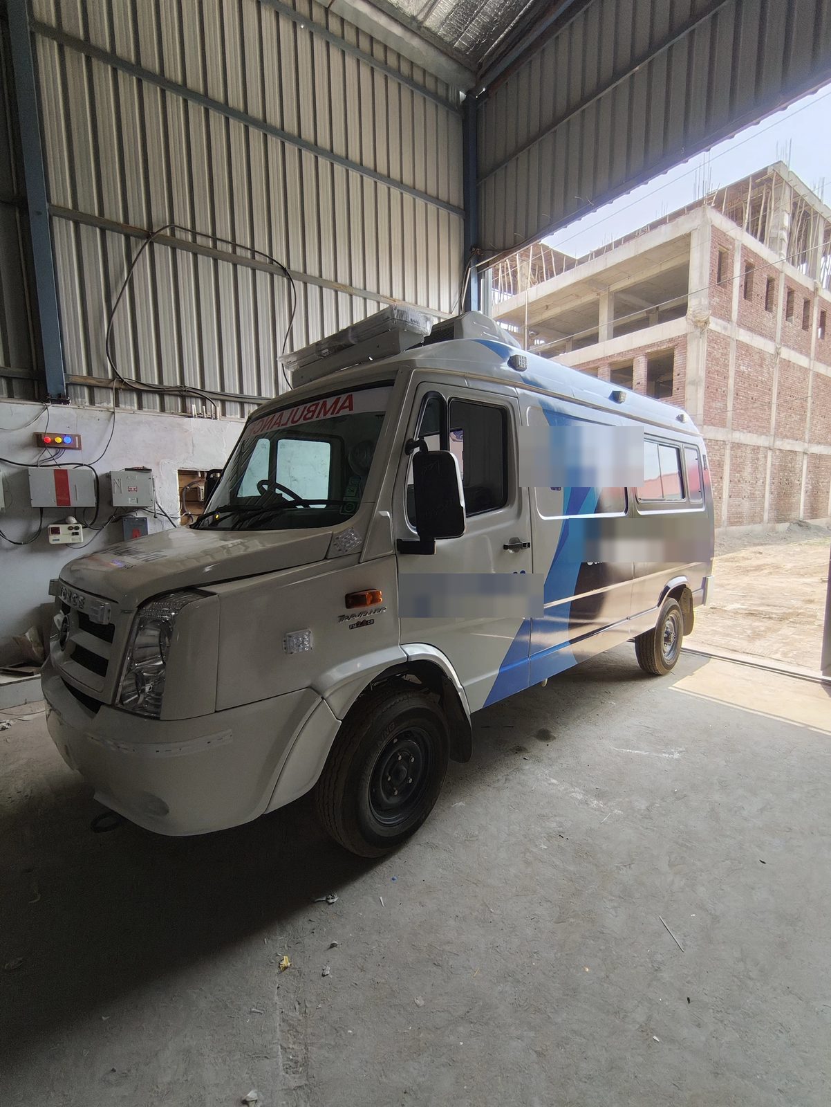 Completed ambulance in the assembly bay, side profile