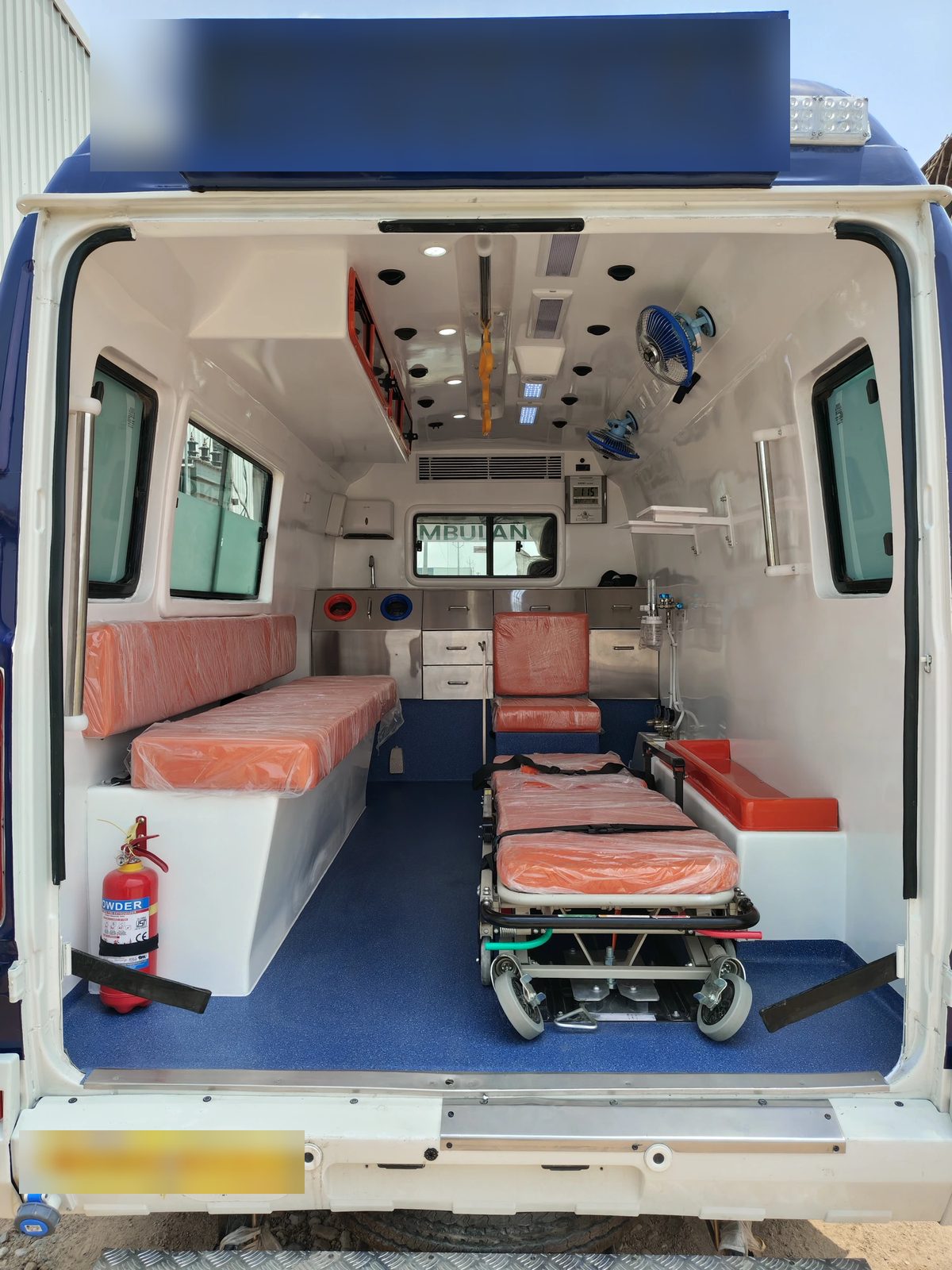 Basic life support ambulance interior with LED destination board above the rear doors